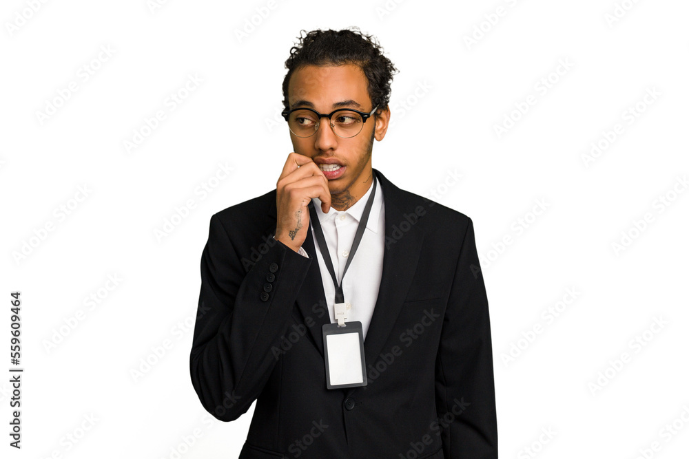 Young African American business man with badge isolated relaxed thinking about something looking at a copy space.