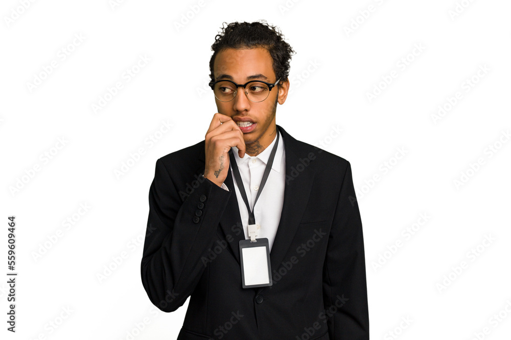 Young African American business man with badge isolated relaxed thinking about something looking at a copy space. Young African American business man with badge isolated relaxed thinking about something looking at a copy space.