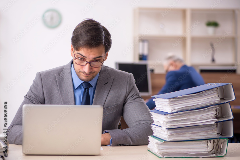 Two male colleagues working in the office Two male colleagues working in the office