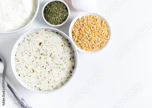 Turkish Yayla or Yogurt Soup with mint sauce (Tzatziki). Top view.