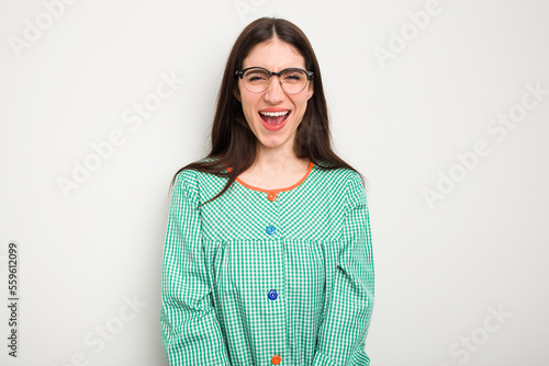 Young caucasian child education teacher isolated on white background screaming very angry and aggressive.