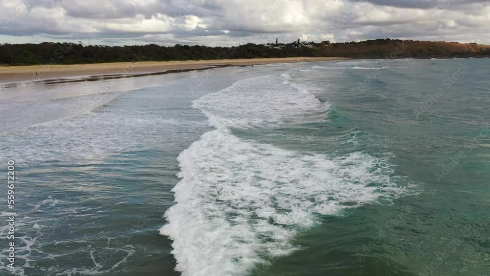 Waves breaking on beach