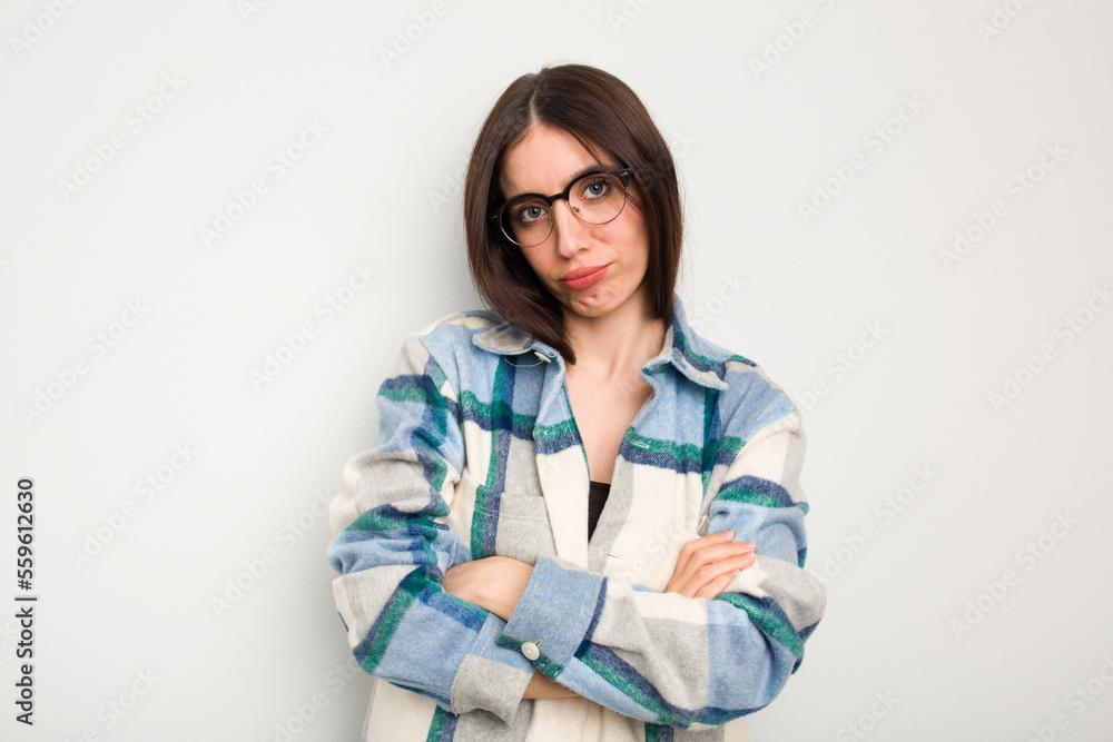 Young caucasian woman isolated on white background who is bored, fatigued and need a relax day. Young caucasian woman isolated on white background who is bored, fatigued and need a relax day.