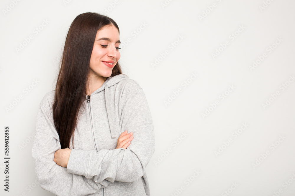 Young caucasian woman isolated on white background smiling confident with crossed arms. Young caucasian woman isolated on white background smiling confident with crossed arms.