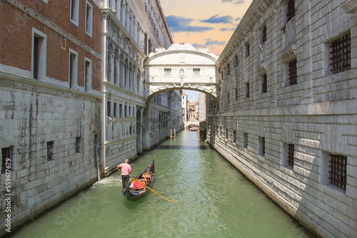 Beautiful view of the Bridge of sighs over one of the Venetian canals in Venice, Italy photo