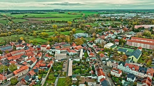 Aerial View Of a neighborhood in Haldensleben town, Saxony-Anhalt, Germany . Flying over houses and trees . photo