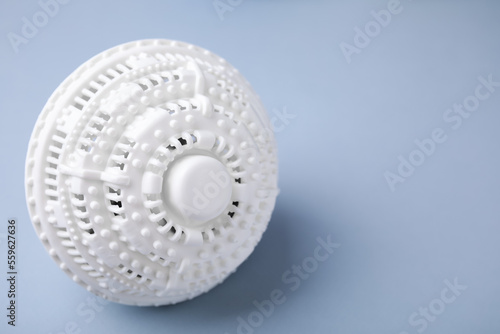 Laundry dryer ball on light grey background, space for text