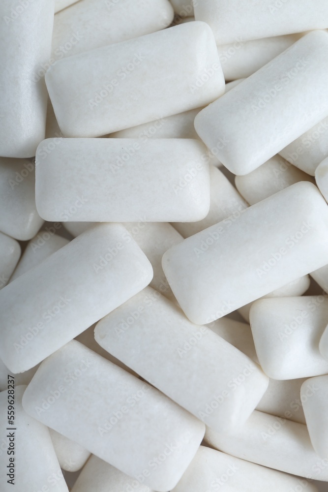 Tasty white chewing gums as background, top view Tasty white chewing gums as background, top view