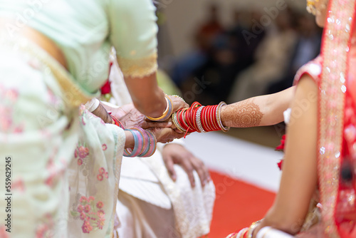 Indian Hindu wedding rituals bride and groom's hands close up © Stella Kou