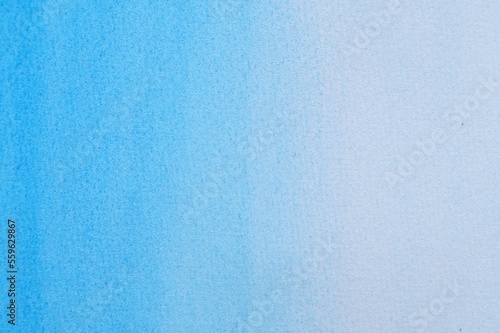 Abstract light blue watercolor painting as background, top view