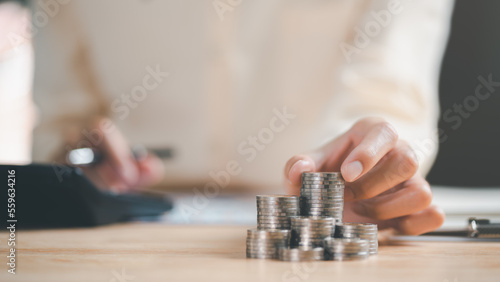 man and pile of coins,investment loan concepts to build residential homes, real estate business, investment savings, mortgages and bank loans, future retirement planning, interest growth,saving money