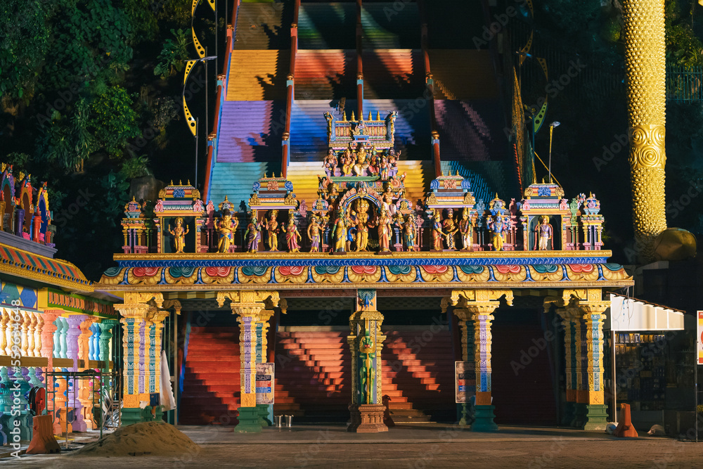Fototapeta premium Entrance of the Batu caves temple in the earning morning with street light only.