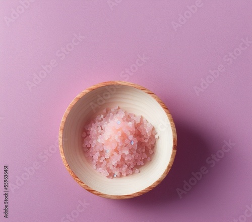 pink salt in a bowl on a white background.