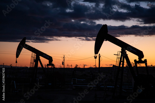 Oil derricks in the sunset in California