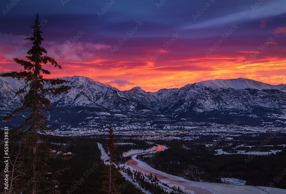 Vibrant Sunrise Sky Over Mountains And Town In Canmore