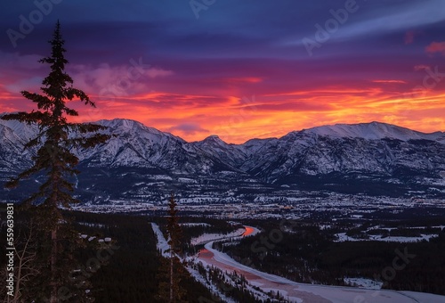 Vibrant Sunrise Sky Over Mountains And Town In Canmore
