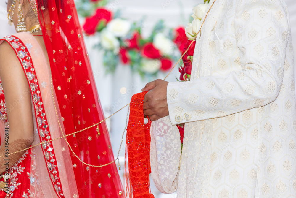 Indian Hindu wedding ceremony rituals bride and groom's hands close up