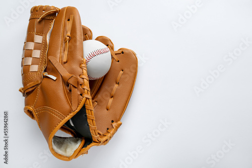 Photography Catcher's mitt and baseball ball on white background, top view with space for text