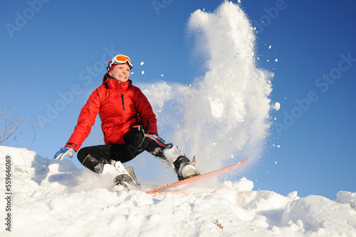 Young woman take fun on the snowboard