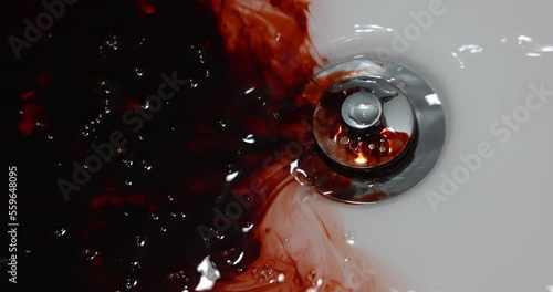 Bloody spittle in the washbasin. Concept: horror themed concepts and ideas, Murder concept background