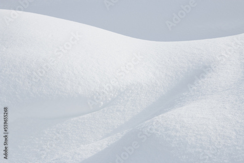 Abstract white curves in winter snow © Alexandra Scotcher