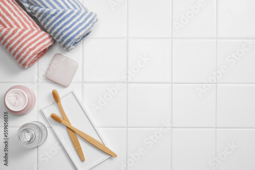 bathroom object on white tile background, top view and copy space