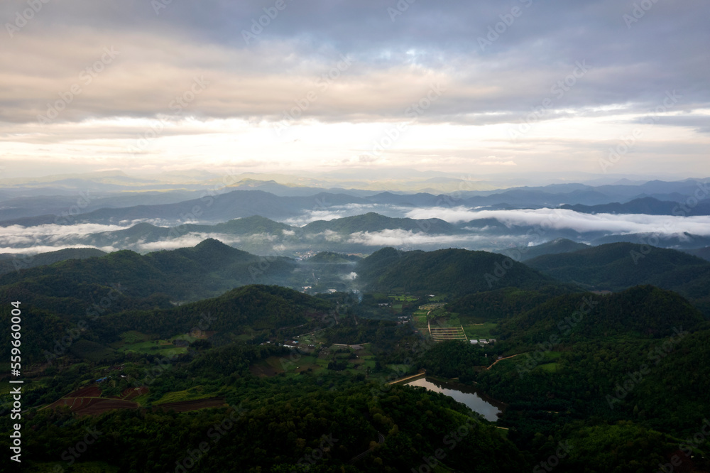 Aerial view of mist, cloud and fog hanging over a lush tropical rainforest after a storm Aerial view of mist, cloud and fog hanging over a lush tropical rainforest after a storm