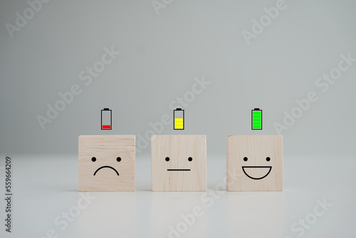 Energy life and emotion level. Happy smile face with full battery and unhappy face low battery on floor. Full energy, Passion, Happy Life, Emotion, positive thinking, world mental health day.