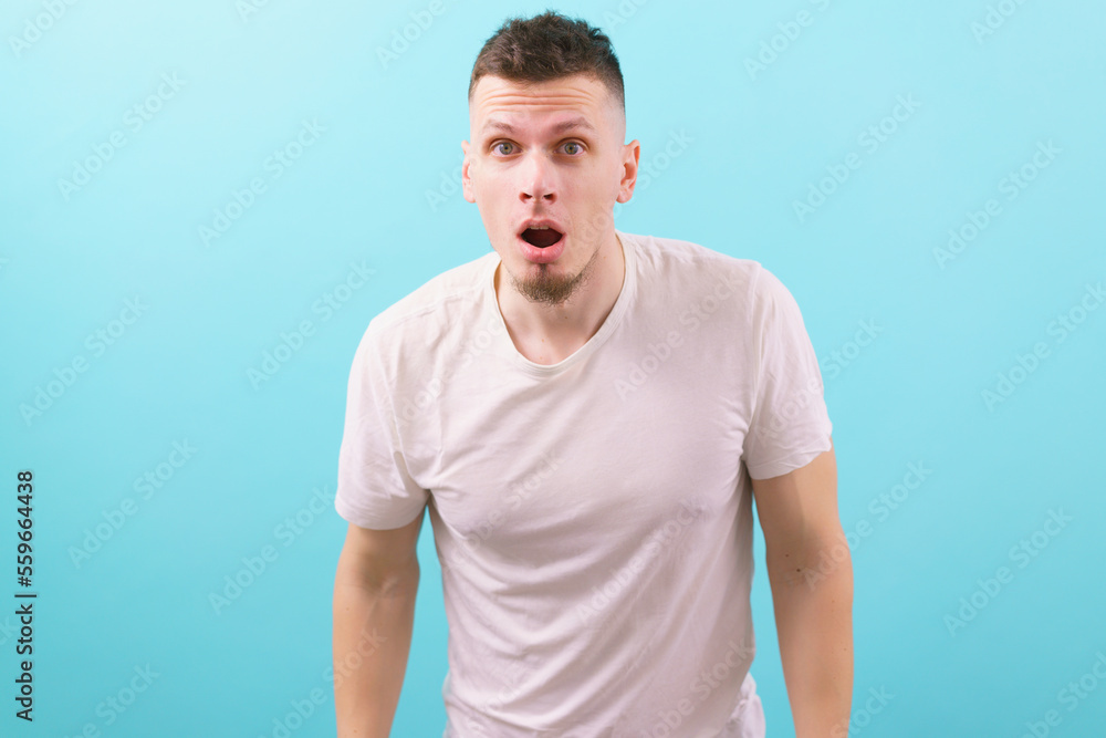 Astonished guy looking at the camera with a wide open mouth and eyes. Male. Caucasian. Face. Man. Studio. White. Young. Facial. Handsome. Camera. Facial Expression. One. Crazy. Excitement. Guy Astonished guy looking at the camera with a wide open mouth and eyes. Male. Caucasian. Face. Man. Studio. White. Young. Facial. Handsome. Camera. Facial Expression. One. Crazy. Excitement. Guy