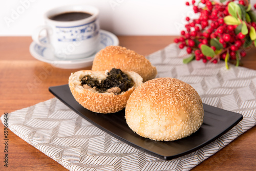 Kompyang bread or Kompia or Guang Bing, a typical Chinese bread that is popular in Indonesia, both filled with meat and empty. Its signature with a sprinkling of sesame on top photo