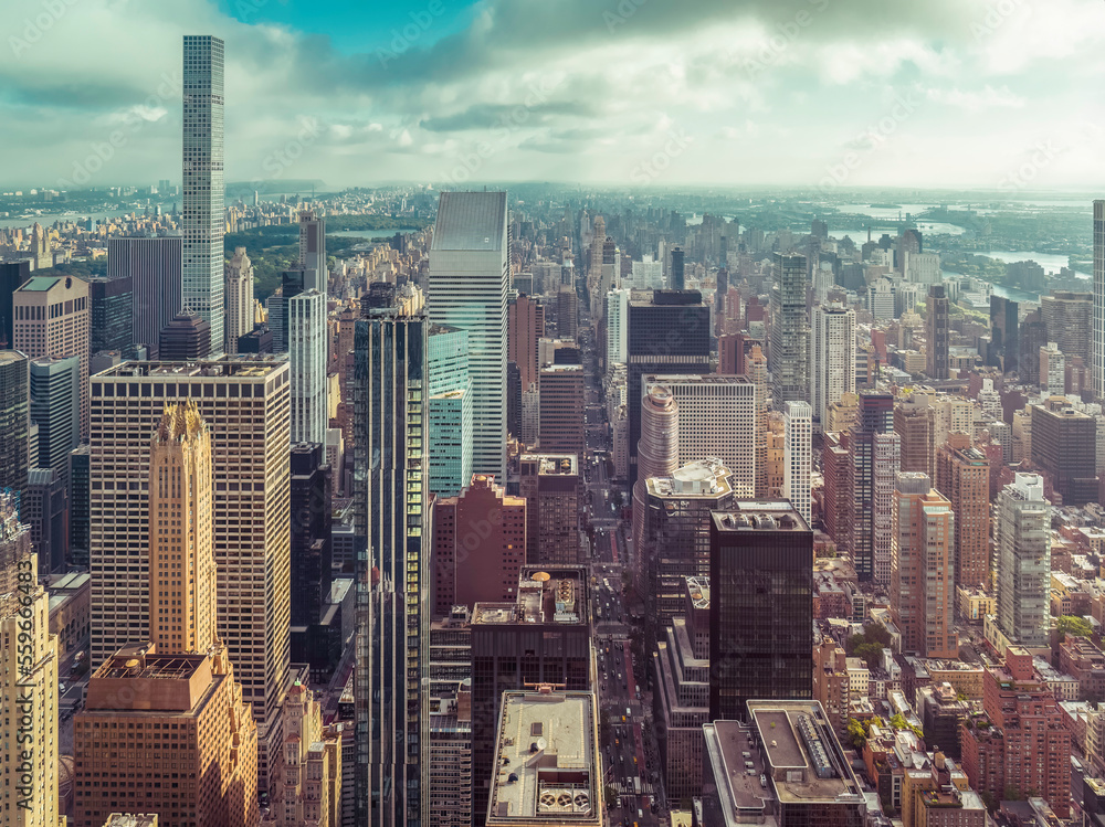 Fototapeta premium New York City Manhattan panorama with skyscrapers next to Central Park and busy street. Aerial high angle view