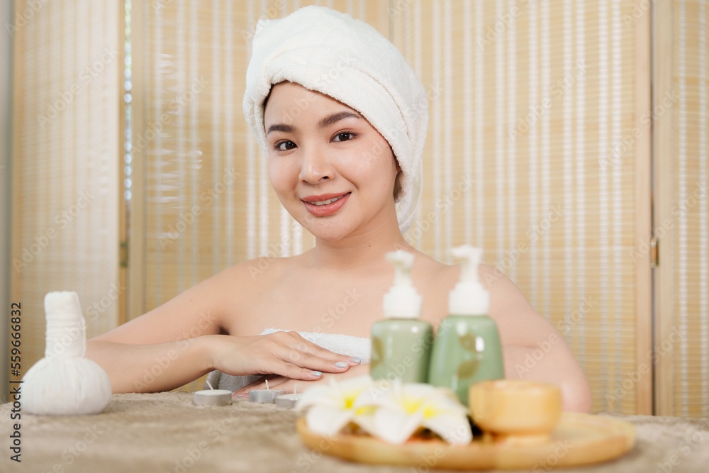 Young woman doing relaxing massage in spa salon. Female being massaged by a masseur. Spa and medicine concept