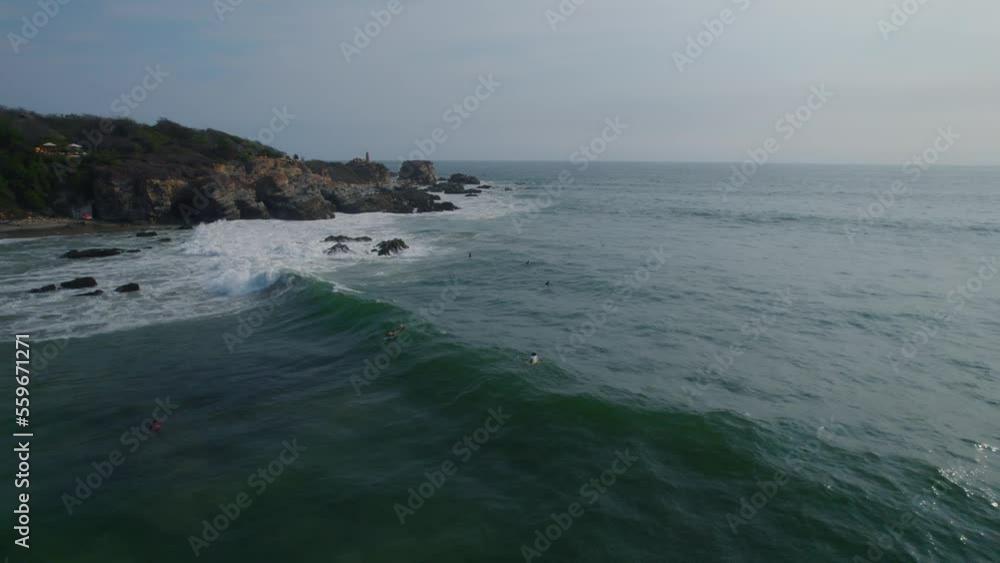Aerial shot of surfers waiting for the perfect wave in Mexico. Aerial shot of surfers waiting for the perfect wave in Mexico.
