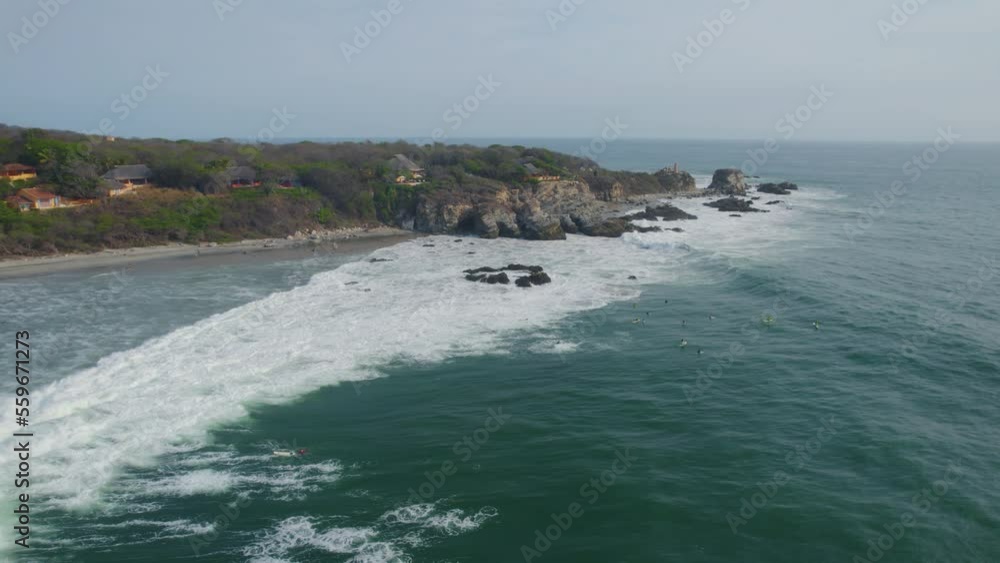 Drone shot of white foamy waves crashing against the shores of Mexico. Drone shot of white foamy waves crashing against the shores of Mexico.