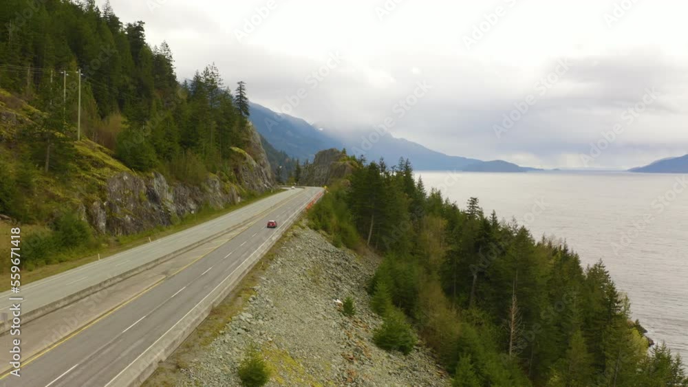 Scenic aerial view of a picturesque mountain highway along the Pacific Coast. Scenic aerial view of a picturesque mountain highway along the Pacific Coast.