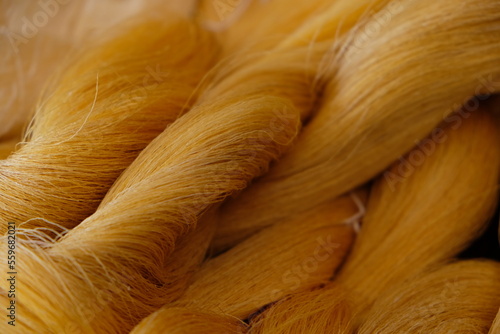 Raw, unprocessed silk yarn from yellow cocoons of the silk worm.