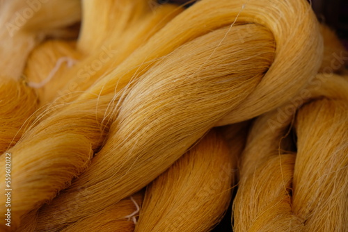 Raw, unprocessed silk yarn from yellow cocoons of the silk worm.