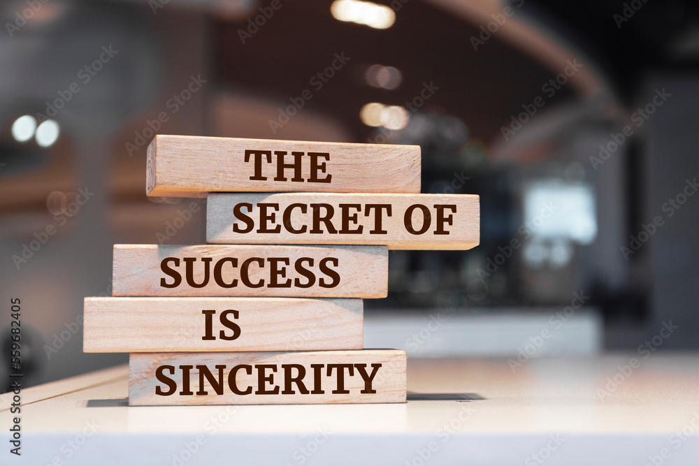 Wooden blocks with words 'The Secret of Success is Sincerity'.