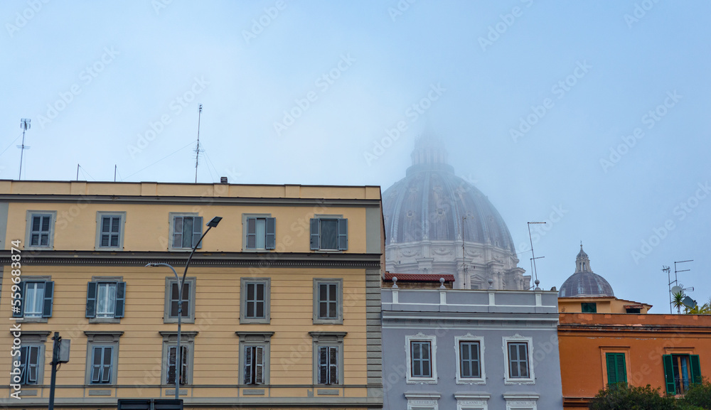 Dome of the church, basilica in the mist. Buildings, tenements, windows, shutters, blue sky.