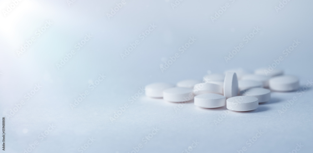 Medicine and health concept. Pills on a blue table. Medicine and health concept. Pills on a blue table.
