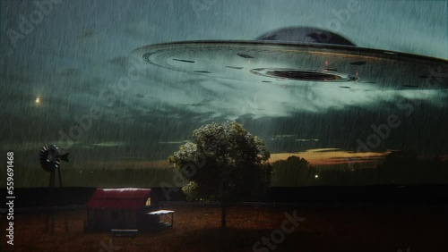 Alien spaceship kidnapping a human with the abduction ray. photo