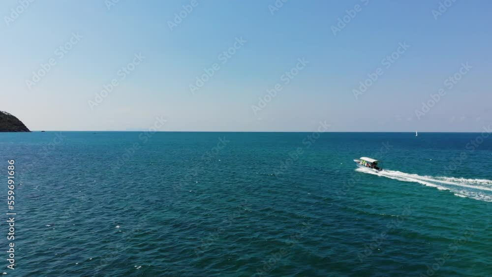 Flying with a drone behind a motor boat in Koh Phangan, Thailand Flying with a drone behind a motor boat in Koh Phangan, Thailand