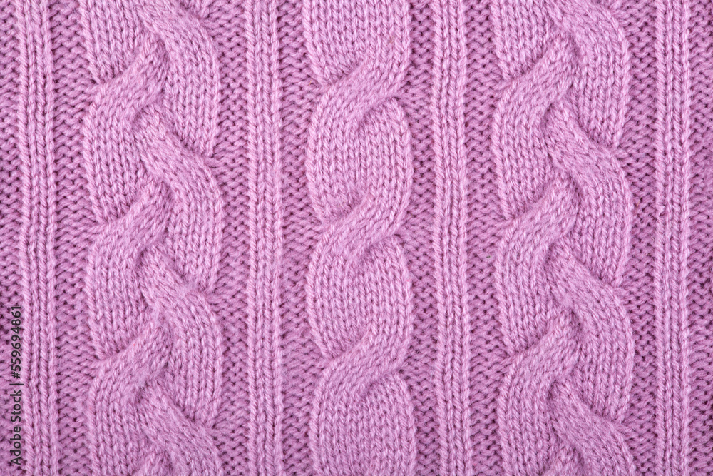 fabric is knitted from woolen yarn. Knitted background. Needlework, handicrafts, hobbies. Close-up fabric is knitted from woolen yarn. Knitted background. Needlework, handicrafts, hobbies. Close-up