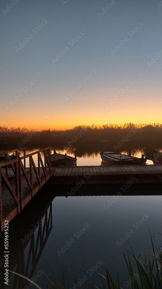 Obraz premium sunset over the river