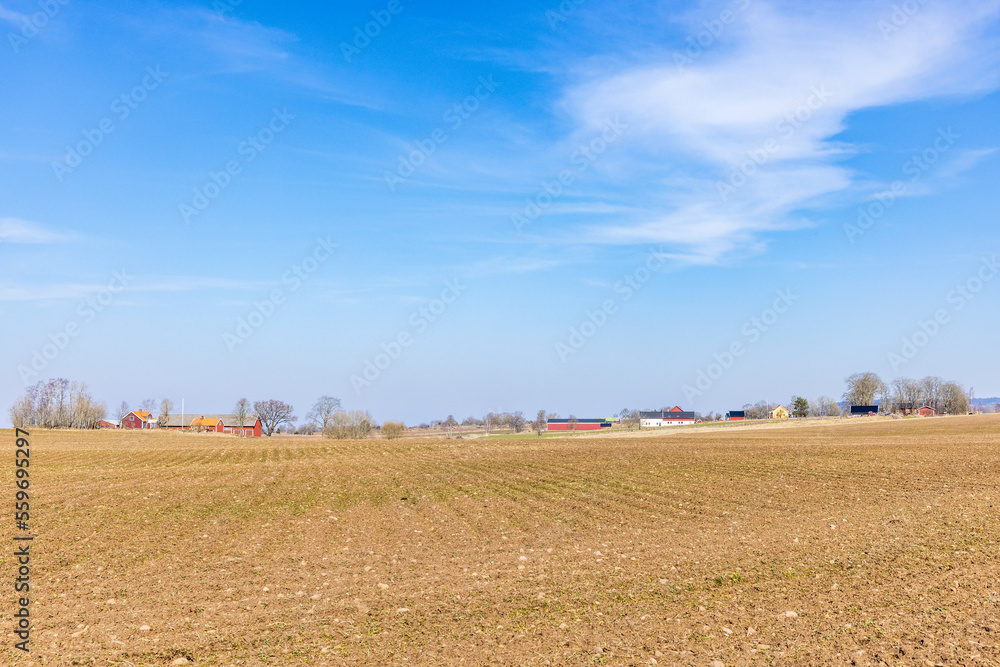Newly sown fields and farms in the countryside
