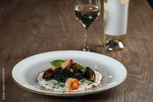seafood, mussels, salmon on a white plate