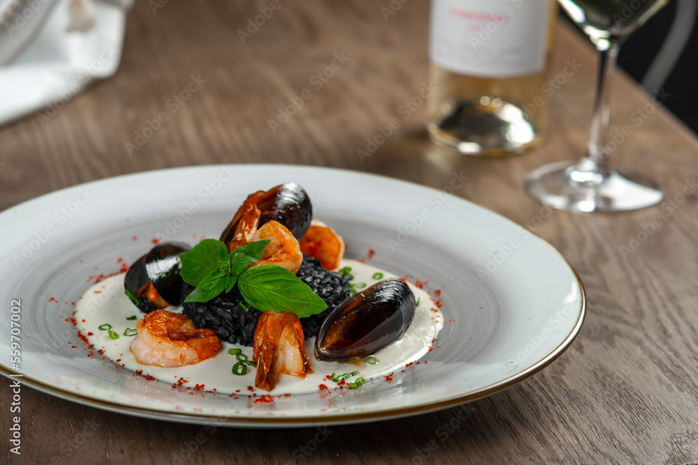 seafood, mussels, salmon on a white plate