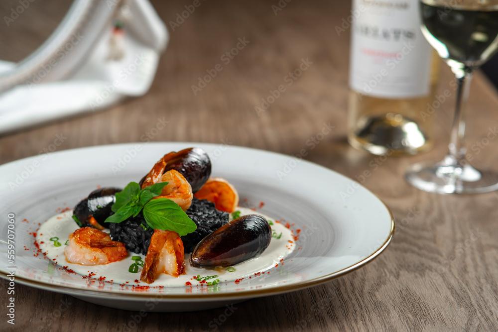 seafood, mussels, salmon on a white plate seafood, mussels, salmon on a white plate