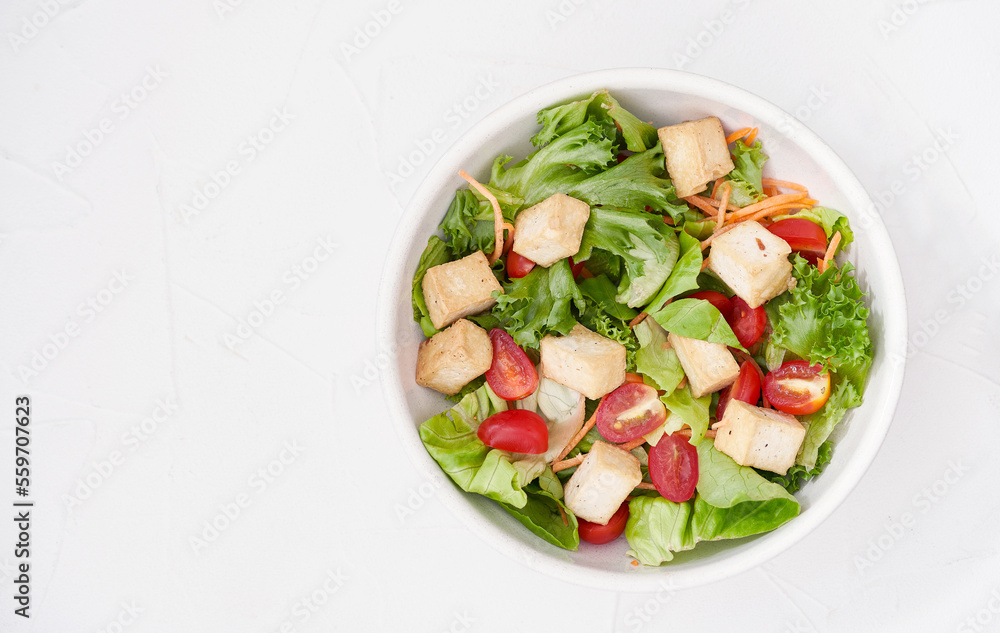 top view flat aly mix salad green leaves tofu on white table background. mix salad green leaves tofu cube on white kitchen background. salad green leaves tofu cube top view flat aly mix salad green leaves tofu on white table background. mix salad green leaves tofu cube on white kitchen background. salad green leaves tofu cube
