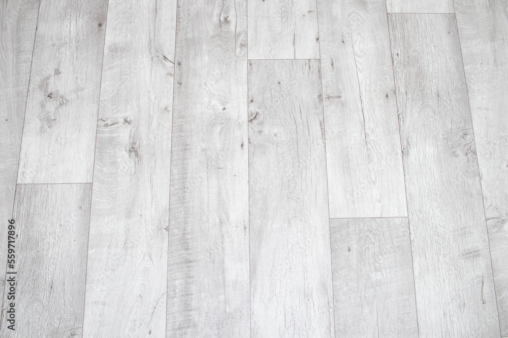 White linoleum with a wood texture. Types of floor coverings. Stock